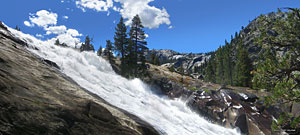 The river leaps over the cliff and slams down into submerged pits, creating more "water wheel" effects, then roars into a narrow channel.