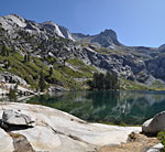 Morning dawns clear and dry on big Hamilton Lake. Looking east from the granite-lined shore up towards Kaweah Gap