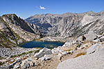 A Park Service trail crew takes a break above a brilliant blue tarn