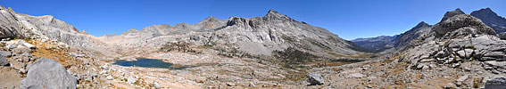 On the east side of Kaweah Gap, a new mountainscape is revealed. In this 230 degree panorama, Nine Lakes Basin is on the left (north-northeast) To the right is the grand rounded valley known as the Big Arroyo going due south, lined with tall, rugged peaks