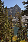 Initial glimpse of the first of the Big Five Lakes, guarded by a rugged peak.