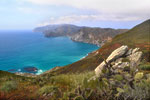 Vivid blue seas below the rugged northwest corner of Santa Catalina. The distant inlet is the western harbor of Two Harbors.