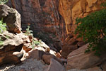 Making our way down giant boulders to our final 2 raps.