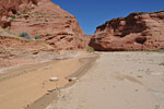 A couple in the distance explores the Hobbit houses on a dayhike from the campground.