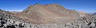 Looking north (L) and east (R) from Jigsaw Pass. The saddle on the ridgeline at left is lower but is not Jigsaw Pass. The first peak (L foreground) is unnamed. Left of center is Picture Puzzle Pk, and right of center, Gendarme Pk