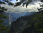 8:30 am. The two pine cones hanging in center point down to Half Dome. Right of Half Dome is Sentinel Dome. On the left is El Capitan.